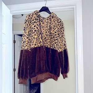 Woman Leopard 3/4 zip-up hooded fuzzy fleece.